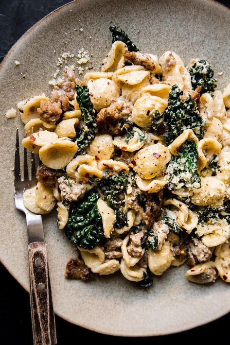 A sumptuous, speedy creamy kale and sausage pasta recipe for all of your weeknight needs. Pasta With Lemon Cream Sauce, Sausage Pasta Recipes Easy, Lemon Cream Sauce Pasta, Creamy Italian Sausage Pasta, Sausage Kale Pasta, Italian Sausage Recipes Pasta, Creamy Sausage Pasta, Creamy Kale, Pasta With Lemon