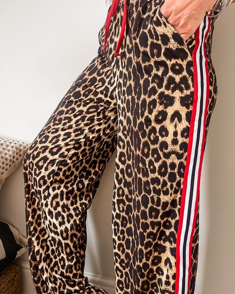 Leopard print is seriously having a moment, and these side stripe wide leg joggers are here to prove it! Perfect for those casual days when you're chasing after the kids but still want to look stylish. They're also an absolute dream for airport outfits – comfy yet chic! And let's be real, with the British summer looking pretty bleak, these leopard print joggers are the cosy, on-trend piece you need right now. Shop now 🛍 . . . #mooboufashion #fashionover30 #fashionover40 #fashionover50 #fas... Airport Outfit Comfy, Leopard Trousers, Outfits Comfy, Wide Leg Joggers, Airport Outfits, Printed Dress Shirts, Mum Fashion, British Summer, Trendy Fall Outfits