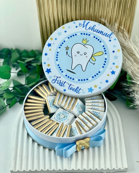 Celebrate your little one’s milestone with our personalized ‘First Tooth’ chocolate box! 🦷✨ A sweet way to share the joy with family and friends. Customize the chocolates with a name or special message, and make this memorable moment even sweeter! 💖🍫 DM us for customizations and let’s make your celebration extra special! 🥳 #FirstToothGift #MilestoneMoments #PersonalizedChocolate #BabyGifts #SweetCelebration #ChocolateLovers #UniqueGiftIdeas #SpecialOccasionGifts #BabyMilestone #SweetMemorie... First Tooth Decoration Ideas, First Tooth Decoration, Tooth Party, Diy Gift Set, Chocolate World, Custom Chocolate, Personalized Party Favors, Personalized Chocolate, Chocolate Decorations