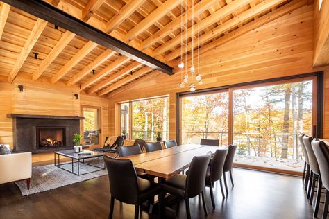 By the time this Greenwood project was complete the lucky owner’s had not just a place to entertain, but also, their “dream house.” The live-edge table in the dining room feels right at home among the warm wood walls and contrasting black furnishings. Norway House, Split Level House, Window Trim Exterior, Residential Architect, Passive House, Windows Exterior, Level Homes, Architecture Portfolio, Flat Roof