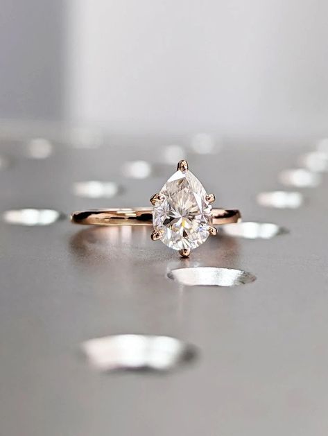 Center BRAVERMAN Moissanite
Cut : Pear Shape Cut
Color : D
Clarity : VVS

#Pear #Shaped #Moissanite #Engagement #Ring #Teardrop #Moissanite #Ring #Yellow #Gold #Ring #Rose #Gold #Simple #Solitaire #Tear #Drop #Cut #Pear #Shape #anniversary #ring #engagement #ring #moissanite #diamond #moissanite #ring #pear #cut #vintage #ring #water #drop #shape #pear #engagement #ring #teardrop #ring #pear #moissanite #solitaire #pear #ring #pear #shaped #solitaire #ring Engagement Ring Teardrop, Ring Pear Shaped, Ring Teardrop, Pear Diamond Engagement Ring, Pear Cut Engagement Rings, Ring Rosegold, Engagement Ring Moissanite, Pear Shaped Engagement Rings, Pear Ring