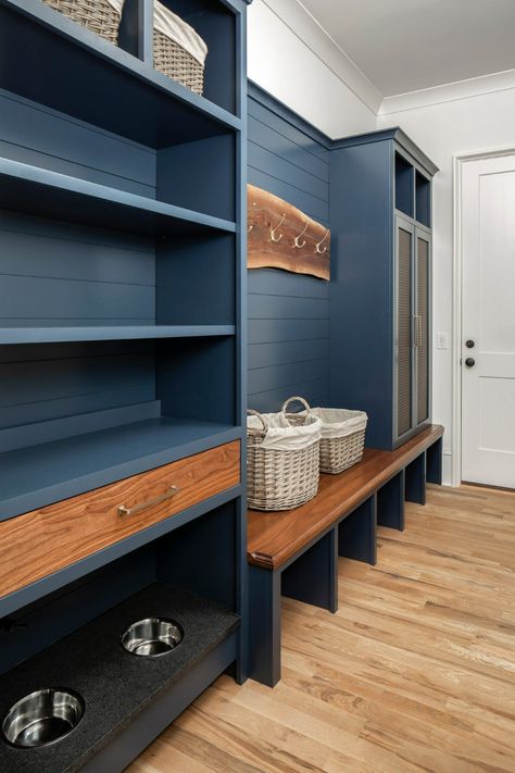 Dirty Work: Elements of the Perfect Mudroom | QualityBath.com Discover Blue Mudroom, Shiplap Trim, Transitional Laundry Room, Mudroom Cabinets, Blue Shelves, Shiplap Backsplash, Mudroom Decor, Mudroom Laundry Room, Blue Backsplash