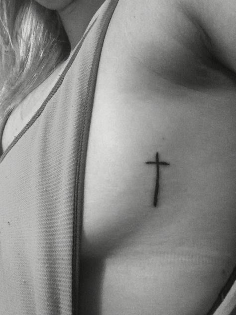 Small cross tattoo Rib Cross Tattoo, Cross Tattoo On Ribs, Cross Tattoo Placement, Cross Rib Tattoos, Ash Tattoo, Small Rib Tattoos, Small Cross Tattoos, Simple Cross Tattoo, Small Cross Tattoo