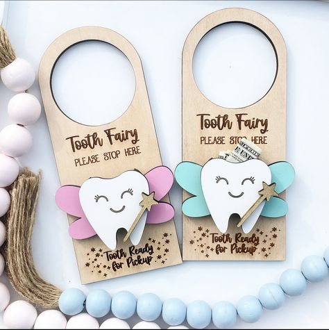 "This tooth door hanger will will make picking up and dropping off easier for the Tooth Fairy!  The tooth is raised so that it can hold the tooth and then money can be inserted for the kiddos piggy bank!  No more worrying about waking the kiddos up with a tooth under the pillow!  Available in pink, teal, metallic silver or metallic gold wings.  Text is laser engraved into the wood \"Tooth Fairy Please Stop Here\" and \"Tooth Ready for Pickup\"" Tooth Fairy Door Hanger, Tooth Fairy Pillow Pattern, Tooth Fairy Door, Tooth Fairy Kit, Tooth Fairy Doors, Tooth Fairy Box, Laser Cut Wood Crafts, The Tooth Fairy, Easter Peeps