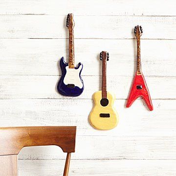 Ceramic Guitar Wall Sculptures, playful decor for any avid music fan who loves the iconic forms of the instrument. Handmade (ad) Ceramic Guitar, Hanging Guitars, Guitar Mount, Kids Instruments, Electric Guitar Lessons, Ceramic Wall Hanging, Clay Magnets, Guitar Kids, Handmade Guitar