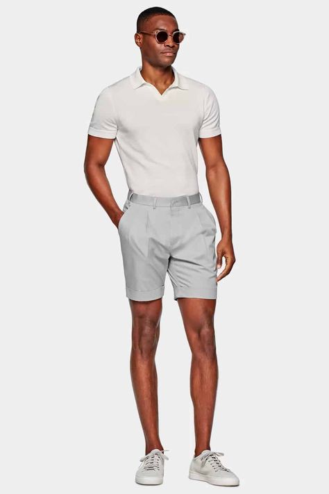 Men's light grey tailored shorts with white knitted polo shirt tucked in with light grey sneakers outfit. This outfit was included in the article: What Colours To Wear With Grey Shorts: 6 Foolproof Shirt Options, on MensFlair.com Grey Sneakers Outfit, Grey Shorts Outfit, Dark Grey Chinos, Mens Dress Shorts, Dress Shorts Outfit, Knitted Polo Shirt, White Linen Shirt, Best Shirt, Knitted Polo