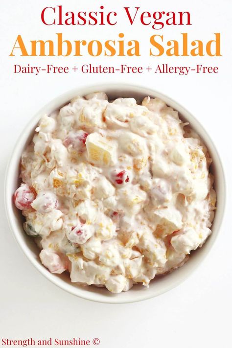 Vegan Ambrosia Salad (Gluten-Free, Dairy-Free) | Strength and Sunshine | This easy Vegan Ambrosia Salad recipe is a sweet and creamy Southern classic! This vintage fruit salad is a retro dessert that's made gluten-free and allergy-free using dairy-free coconut whipped cream, sour cream, canned pineapple, mandarins, cherries, coconut, and mini marshmallows! Quick and simple to customize or keep it like grandma's nostalgic 5 cup salad recipe! Vegan Ambrosia Fruit Salad, Dairy Free Ambrosia Salad, 5 Cup Salad Recipe, 5 Cup Salad, Ambrosia Salad Recipe, Ambrosia Recipe, Ambrosia Fruit Salad, Allergy Recipes, Retro Desserts