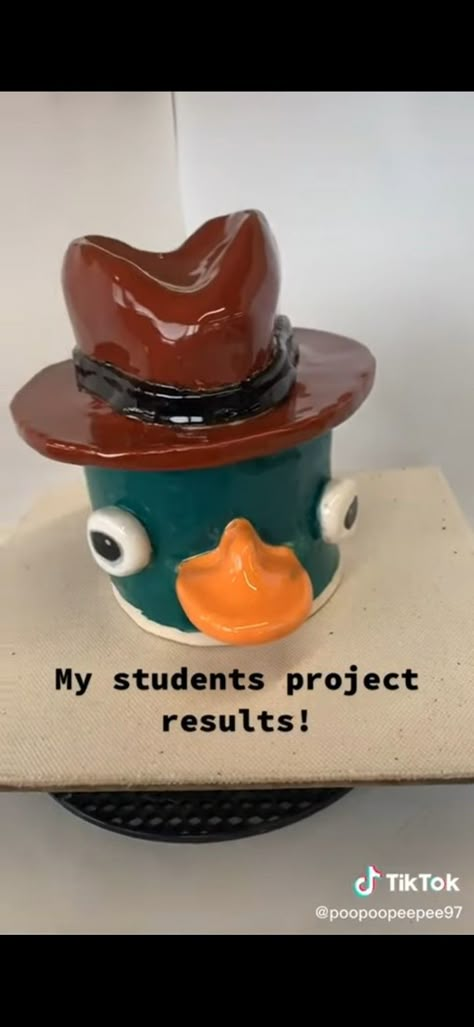 Perry The Platypus Clay Mug, Perry The Platypus Ceramic, Clay Face Pot, Pop Culture Ceramics, Creative Pinch Pot Ideas, Creative Pinch Pots, Perry The Platypus Clay, Clay Daisy, Ceramic Pinch Pots