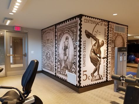 Customer Amy W. added a fun twist to this gym remodel. Instead of silhouettes of athletes or inspirational word clouds, Amy went with murals of vintage postage stamps. These stamps have classic Olympic sports themes like a runner at the starting line and a discus thrower winding up to take his shot. What a great way to celebrate physical fitness while giving your gym some truly unique decor! Gym Remodel, Vintage Sports Aesthetic, Gym Decor Ideas, Olympic Theme, Fitness Wallpaper, Gym Wallpaper, Gym Wall, Starting Line, Sports Aesthetic