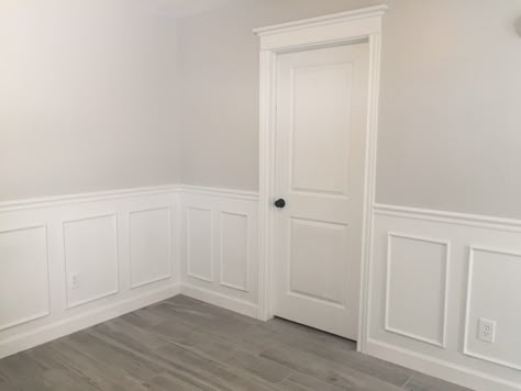 Grey walls with white wainscoting White Panelling Dark Walls, White And Grey Paneling, White Paneling Grey Walls, Grey And White Panelling, Half Grey Half White Walls, Grey Walls With White Wainscoting, Grey And White Accent Wall, White Wainscoting White Walls, Green Waynes Coating