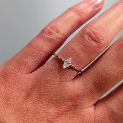 The minimalist engagement ring of dreams... 💍✨️ This pretty sterling silver ring features a simple marquise cut cz in a 4 prong setting. With just a 1mm band width and depth, it makes an ideal dainty and affordable engagement ring ready to be stacked with the future wedding ring! 😍 . . . #Engagement #Engaged #EngagementRing #SterlingSilver #Jewellery #Ring #MarquiseCut #MarquiseRing #BridalSet Rings Engagement Silver Simple, Minimalist Wedding Ring Silver, Simple Wedding Ring Stack, Silver Marquise Engagement Ring, Simple Engagement Rings Dainty, Affordable Engagement Ring, Minimalist Wedding Rings, Engagement Ring On Hand, Simple Engagement