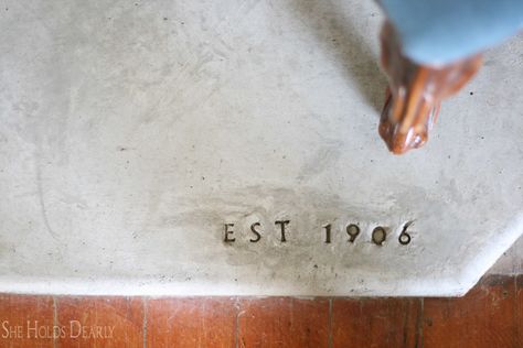 Pouring your own concrete hearth is not as hard as you may think. Here is how we created our custom concrete hearth in our fireside room. Cement Hearth, Wood Stove Hearth Pads, Pellet Stove Hearth, Concrete Hearth, Hearth Pad, Hearth Pads, She Holds Dearly, Wood Stove Hearth, Diy Cement Planters