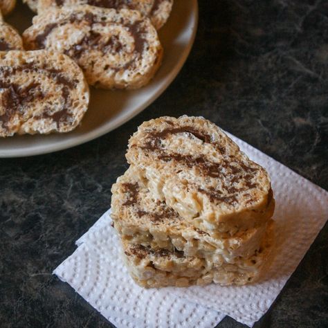 If you are looking for another quick and easy dessert here it is!  This simple Peanut Butter Rice Krispie Roll log takes your ordinary Rice Krispie square up a notch and tastes delicious.