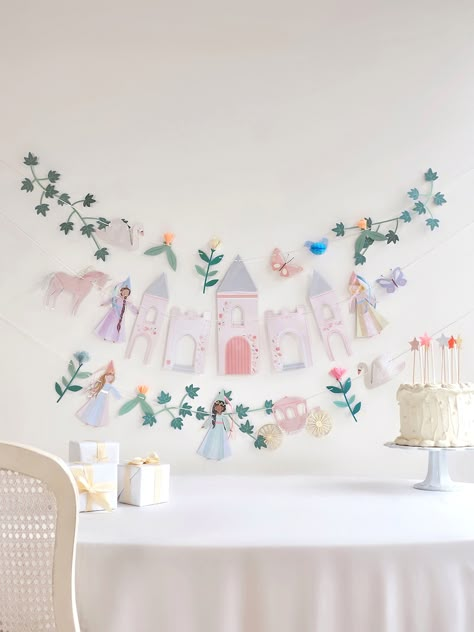 Create an enchanted fairy tale setting with this most majestic garland! Featuring princesses, a castle, a unicorn and a carriage, it will look magical at your princess party. It's also a beautiful decoration for the bedroom – make your kids feel like royalty all year round. Details The garland is created from 2 pieces Three princesses with organza and satin ribbon embellishments Crepe paper and tissue paper flowers Shiny gold metallic thread on the flowers and unicorn Ivory tissue paper for the Princess 3rd Birthday Party Food, Tiara Birthday Party Ideas, Princess Birthday Party Crafts, Forever A Princess Birthday Party, Princess Theme Party Decorations Diy, Minimalist Princess Birthday Party, Princess Party Welcome Sign, Fairy Princess Birthday Party Decoration, 5th Birthday Princess Theme