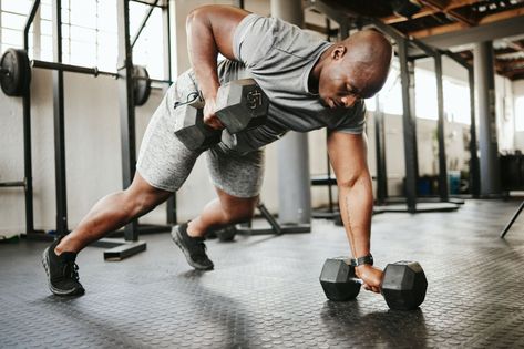 Dumbbell, fitness and bodybuilder black man with workout training in gym or garage studio for wellness, body goal and motivation. Power, strong and african sports man doing push up exercise with gear Dumbbell Workout Plan, Daily Stretching Routine, Stretch Routine, Hamstring Stretch, Men's Health, Resistance Training, Body Fitness, Men’s Health, Aging Well