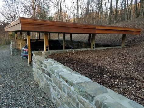 Shed Built Into Hillside, Garage In A Hillside, Underground Courtyard, Garage Built Into Hillside, Hillside Garage, Drive Through Carport, Carport On Sloped Driveway, Open Carport With Storage Room, Cantilevered Carport