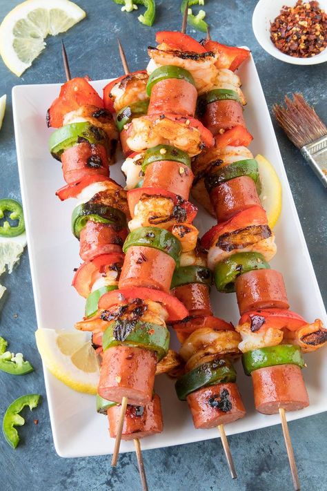 Grilled Shrimp and Sausage Skewers with Spicy Chili Glaze - These easy shrimp and sausage skewers are basted with a spicy chili glaze made with chili paste, vinegar and lemon juice, then grilled to perfection. Done in 20 minutes! AD #EckrichSmokedSausage #Dinner #Shrimp #Sausage #TurkeySausage #EasyDinner Sausage Skewers, Summertime Meals, Barbecue Ideas, Dinner Shrimp, Shrimp And Sausage, Shrimp Sausage, Bbq Pork Ribs, Bbq Shrimp, Grilled Shrimp Recipes