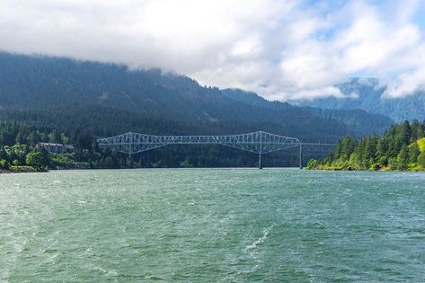 You'll find the Bridge of the Gods in the Columbia River Gorge. On the Oregon side, it's located in Cascade Locks, 44 miles east of Portland. The bridge was completed in 1926, but it got its name from a much more ancient bridge. Ancient Bridge, Washington Vacation, Native American Legends, Oregon Vacation, Multnomah Falls, Oregon Washington, Pacific Crest Trail, Salmon Fishing, Columbia River Gorge