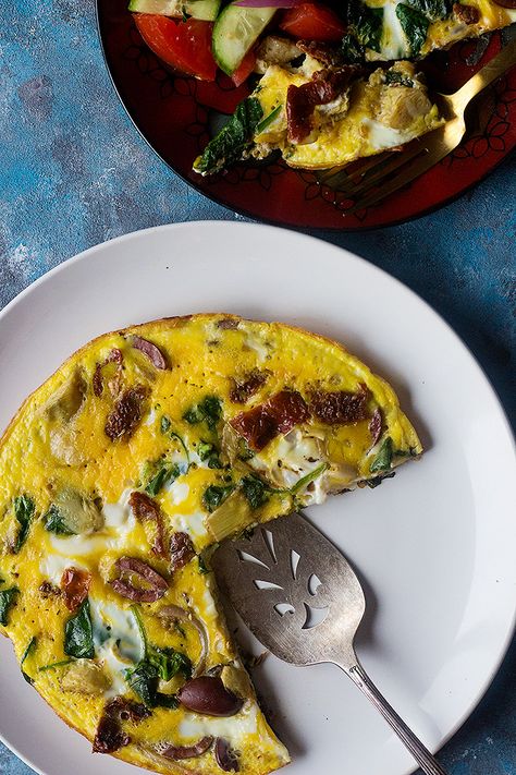 This Mediterranean spinach omelette is packed with amazing flavors. With olives and artichokes, this spinach omelette is one to not miss. #mediterraneanbreakfast #breakfastrecipe #omeletterecipe #spinachomelette Egg And Spinach, Spinach Omelette, Mediterranean Breakfast, Better Digestion, Omelette Recipe, Healthy Dog Food Recipes, Mediterranean Cuisine, Bread Recipes Sweet, Bread Recipes Homemade