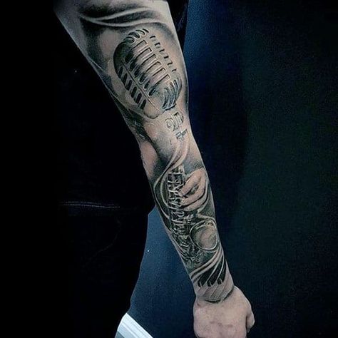 50 Coolest Sleeve Tattoos for Men in 2022 - The Trend Spotter Microphone Tattoo, Music Sleeve, Music Tattoo Sleeves, Sleeve Tattoos For Men, Music Notes Tattoo, Tattoo Music, Rock Tattoo, Guitar Tattoo, Music Tattoo Designs