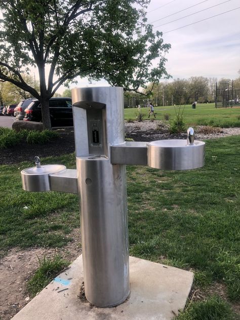 This pedestal-mounted water bottle filling station with bi-level, push-button drinking fountains is a park favorite. Its stainless steel construction makes it resistant to sunlight, heat, moisture, and other wear, and a heavy-duty, vandal-resistant access cover provides additional durability. #DrinkingFountain #OutdoorDrinkingFountain Water Bottle Filling Station, Outdoor Drinking Fountain, Bottle Filling Station, Drinking Water Fountain, Pet Fountain, Drinking Fountains, Fountain Design, Water Fountains Outdoor, Drinking Fountain