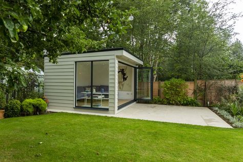 Looking for a Garden Room with the Wow Factor? Look no further then this gorgeous garden building. This simple design has created a luxurious additional family room for our customers in Haywards Heath. The square shaped building has aluminium bi-fold doors which connect the room to the surrounding garden beautifully. Sitting at 3.5x3.5m and cladded in hardie plank weatherboard by James Hardie this fibre cement cladding is incredibly durable and has the benefit of being maintenance free. Cement Cladding, Fibre Cement Cladding, Hardie Plank, James Hardie, Fiber Cement, Hobby Room, Garden Studio, Garden Buildings, Gorgeous Gardens