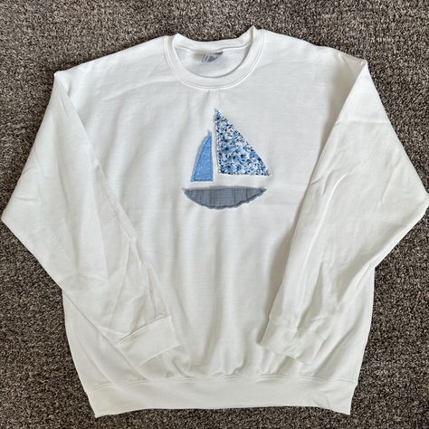 Gildan Heavy Blend crewneck with a patchwork sailboat hand-sewn by me using fabric scraps. - Crewneck color: white - Unisex - Size up for an oversized fit! - Content: 50% Cotton, 50% Polyester - Care: machine wash, cool, non-chlorine bleach when needed, tumble dry, medium, do not iron, do not dry clean Sailboat Patchwork Sweatshirt, Cute Diy Crewnecks, Making Sweatshirts With Friends, Diy Crewneck Sweatshirt Ideas, Diy Hoodies, Crewneck Sweatshirt, Sweatshirt Ideas, Patchwork Hoodie, Easy Diy Clothes