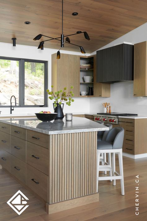 Modern white oak cottage kitchen with an angled white oak slated kitchen island and a custom metal fluted range hood. Fluted Range Hood, Modern White Oak Kitchen, Framed Cabinets, Modern Cottage Kitchen, White Oak Furniture, Kitchen Styling Modern, White Oak Kitchen, Corner Kitchen Cabinet, Framed Cabinet