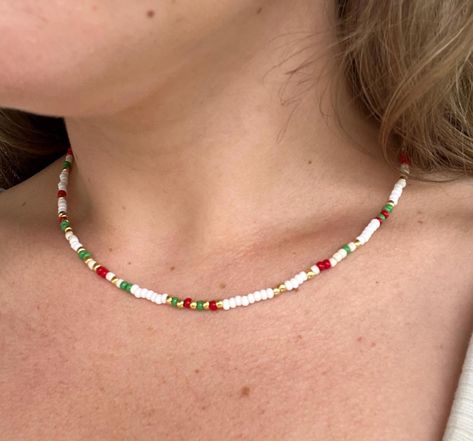 "Christmas in July" inspired beaded necklace with red, green, gold, and white beads (all 8/0). 16.5 inches  If you like this necklace, but want a different length, just message me!  I'm happy to accommodate!! Christmas Necklace Ideas, Festive Red Handmade Beaded Necklace, Handmade Red Beaded Necklace For Holidays, Summer Red Necklace With Colorful Beads, Christmas Beaded Necklace, Red And Green Beads Necklace, Christmas Bead Necklace, Christmas Light Necklace, Vibrant Red Beaded Necklace