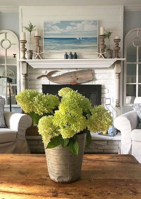 Fireplace decor ideas for those who love the sea. Some simple coastal and nautical ideas for your fireplace. Featured on Completely Coastal. Bathroom Rustic Decor, Coastal Fireplace Ideas, Beach House Fireplace, Coastal Mantle Decor, Beach Fireplace, Coastal Fireplace, Hearth Decor, Wood Whale, Farmhouse Mantle Decor