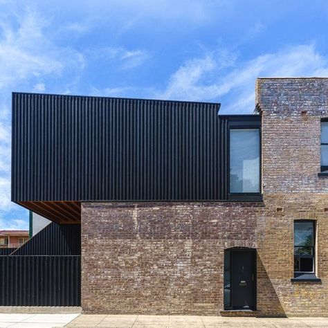 Abodo Wood on Instagram: "In Sydney's Inner West, a corner store dating back to c.1900 has gone through a sympathetic and respectful renovation to now serve as the studio space for @kreisgrennanarchitecture, complete with an upstairs apartment. A rear upper level extension in Vulcan board and batten cladding is starkly contrasted against the faded terracotta tones of the historic brick. Protector Nero's dark finish and the black accents on the original building help to visually connect the two Faded Terracotta, Board And Batten Cladding, Upstairs Apartment, Black Cladding, Timber Battens, Timber Architecture, Glazed Brick, Brown Brick, Ocean Grove