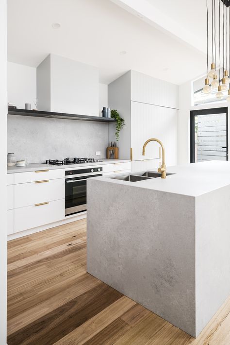 Today's inspiration comes from this project on Oliver’s hill Frankston South by @tuxluxnet! The Raw Brushed Brass and brass cabinet handles create the perfect amount of colour against the cool concrete @ceasarstone benchtops and neutral cabinetry.  Product featured: 30694-91 Pegasi M Sink Mixer Curve, Pull Out, Raw Brushed Brass  #faucet #faucetstrommen #kitchen #design #kitchendesign #modernkitchen #whitekitchen #paneledwalls #concrete #concretecountertops #rawbrushedbrass #brasstapware #brass White Concrete Kitchen, Concrete Benchtop, Caesarstone Kitchen, Scandi Kitchen, Timber Kitchen, Kitchen Benchtops, Brass Sink, Concrete Kitchen, New House - Kitchen