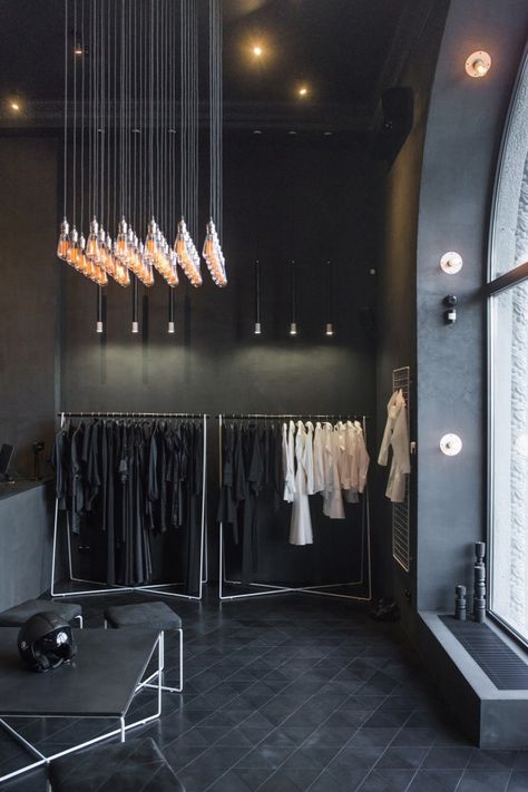 retail interior, triangular flooring, bulb installation | PODOLYAN Store Project / FILD design thinking company Clothing Store Design, Retail Interior Design, Retail Inspiration, Decor Studio, Store Interiors, Design Apartment, Showroom Design, Retail Store Design, Dark Interiors