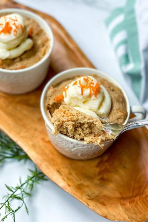 This Carrot Cake Mug Cake recipe is a 3-minute microwave mug cake dessert that's perfect for the season. Sweet, delicious, and oh-so-easy! Unlike its time-honored inspiration (the oven-baked carrot cake), our recipe is made super quick and easy in the microwave. And packed with simple ingredients you likely have on hand. You need to make this treat today! Vegan Carrot Mug Cake, Mug Carrot Cake Microwave, Quick Mug Cake Microwave Recipes, Carrot Cake In A Mug, Microwave Mug Cake Recipes, Carrot Cake Mug Cake, Easy Microwave Mug Cake, Mug Dessert Recipes, Microwave Mug Cake