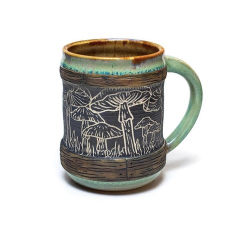 #mushroom #sgraffito #ceramics #coffeemug #mushroomtea #mycelium #forage #psilocybinmushrooms #psychedelics #psychedelicart #naturalworld #folkart #wheelthrownceramics #handmade #estyshop #mushroomlover #shrooms #mugsofinstagram #potterycollector #mugcollector #mountainart #healingfoods #naturelover #hiking #valentinesgift #localart #coffeelover #mugcustom #naturalart #mugshot Sgraffito Mushrooms, Mushroom Sgraffito, Sgraffito Ceramics, Sgraffito Designs, Sgraffito Pottery, Mushroom Tea, Wheel Thrown Ceramics, Glazing Techniques, Wheel Throwing