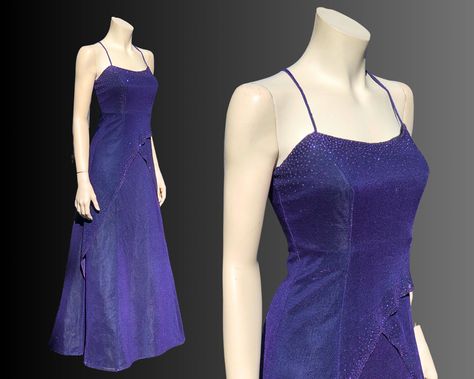 VINTAGE 90's PURPLE GLITTER GOWN Stunning Showstopper Glitter Gown in Rich Jewel Tone Purple! Purple Metallic Fabric with Purple Glitter at the Bust and on the edges of each Layer. Fitted Bodice Zips on the side, Spaghetti Straps cross in the back. Full Layered Skirt has a layer of Tulle to create fullness in the Skirt. BY: Jump Apparel SIZE: 3/4 or XS FABRIC: Tulle/Acetate/Metallic with Acetate lining CONDITION: Excellent  MEASUREMENTS  Bust 30" Waist 27" Hips 34" SHIPPING Canada: shipping list Jewel Tone Purple, 90s Vintage Dress, Outfits Purple, Glitter Gown, Tulle Underskirt, Gown Vintage, Purple Metallic, Elegant Dresses Classy, Goddess Dress