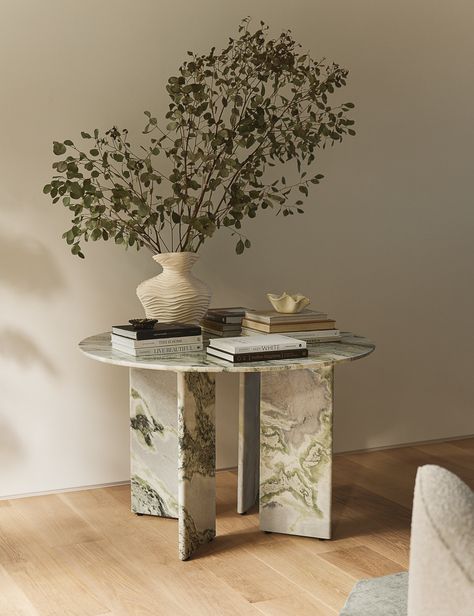 Angled legs bring a striking geometry to this marble dining table, setting off a masterpiece of craftsmanship and understated luxury. Its distinctive mineral patterns create an aura of opulence, fashioning a table that can elevate every day and host every occasion.