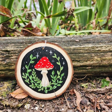 Sweet, whimsical mushy. Acrylic on wood. We all need a touch of whimsy in our lives (more like gallons)✨️💫 What kind or color of mushroom would you like to see on an ornament next? I can't get enough of 'em! Fairy Core Mushroom, Mushroom Sign, Goth Embroidery, Mushroom Ornaments, Crafts 2024, Mushroom Illustration, Wood Paintings, Wood Discs, Work Decor