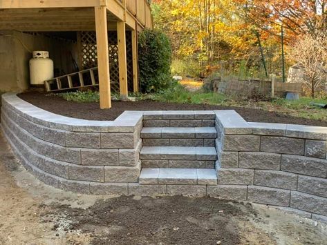 Curved Retaining Wall With Steps, Stone Retaining Wall With Steps, Patio On Sloped Yard Backyards, Concrete Patio Ideas With Retaining Wall, Sink Holes In Yard, Sloped Backyard Patio Ideas, Landscape Design Retaining Wall, Retaining Wall Steps Sloped Backyard, Retaining Walls With Steps