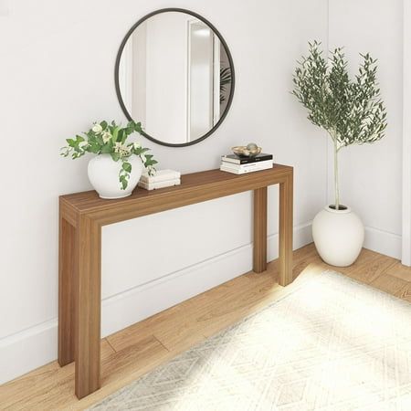 Add a touch of style to any room with the Plank+Beam Modern Console Table, featuring sleek and minimalist design. The perfect combination of modern style and quality craftsmanship, this long console table has a strong and sturdy design that complements any space. Knot-free, solid pine wood construction provides superior strength and durability, while non-toxic, low-VOC finishes create a clean and healthy home. Stylish and versatile, this console table is the ideal accent piece for your living ro Narrow Hall Tables, Minimalist Entryway Decor, Living Room Entryway No Foyer, Long Narrow Hallway Decorating, Entry Table With Mirror, Narrow Console Table Entryway, Console Table Behind Couch, Narrow Hall Table, Chic Console Table