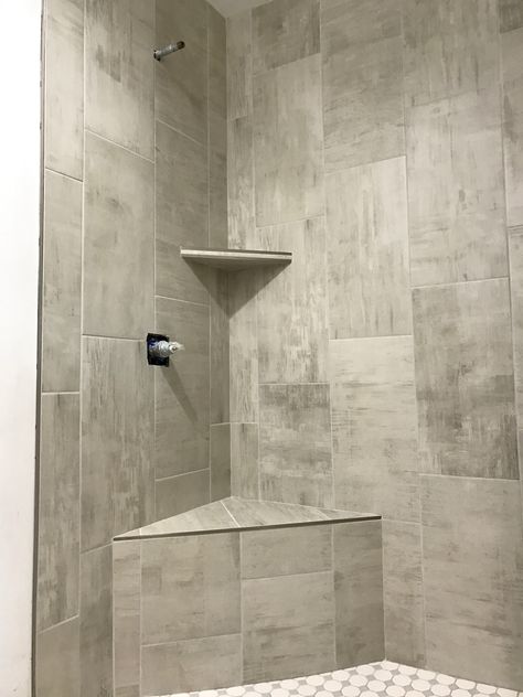 Custom shower with corner bench seat and corner shelf. 12x24 vertical stack tile Shower With Corner Bench, Corner Bench Seat, Corner Shower Seat, Shower Corner Shelf, Corner Bench Seating, Floating Corner Shelves, Corner Wall Shelves, Corner Bench, Master Shower