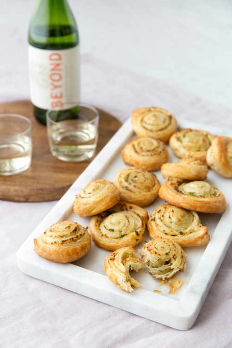 Flaky Garlic Bread Pinwheels | Kitchn Bread Pinwheels, Friendsgiving Appetizers, Friendsgiving Recipes, Happy Hour Appetizers, New Years Appetizers, Friendsgiving Food, Pastry Appetizer, Fancy Appetizers, Easy Puff Pastry