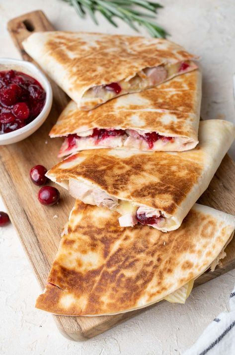 These delicious quesadillas are made with leftover turkey, leftover cranberry sauce, and three types of cheese (brie, cheddar, and mozzarella). They take minutes to make! They are seriously so good I will be making them from now on a regular basis, not just with leftover turkey. They are also great with chicken, give them a try! Turkey Quesadilla Recipes, Delicious Quesadillas, Turkey Quesadilla, Cheese Brie, Chicken Breast Tenderloins, Turkey Ideas, Cranberry Orange Sauce, Turkey Cranberry, Leftover Thanksgiving