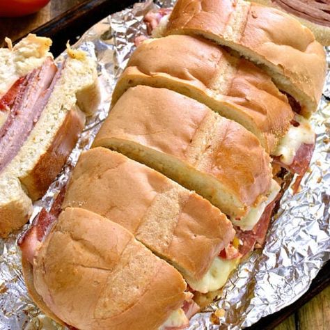 Italian Party Sub - Lemon Tree Dwelling Italian Vinaigrette, Lemon Tree Dwelling, Italian Themed Parties, Sub Sandwich, Sliced Salami, Italian Party, Italian Sub, Turkey Ham, Appetizer Sandwiches