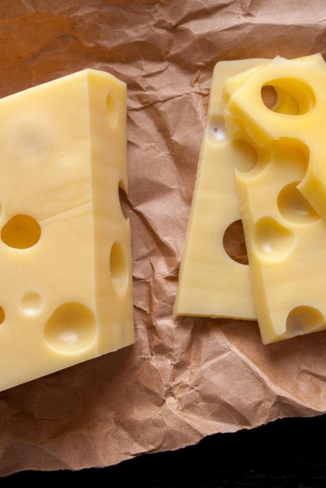 Many people eat sliced Swiss cheese on their sandwiches and melted on burgers, but how much do you really know about this delicious dairy food? Swiss cheese isn’t just a single type of cheese at all. Rather, Swiss cheese is an entire category of cheeses including varieties like Emmental and Appenzeller. The original Swiss that most others are compared to is Emmental, a cheese from abroad that Americans really should try. Swiss cheeses are all of medium-hard texture and have one thing in common: Swiss Cheese Recipes, Low Sodium Cheese, Cheese Recipes Homemade, Cheddar Cheese Recipes, Cheese Making Recipes, Queso Cheddar, Cheese Shop, Cheese Dishes, Monterey Jack