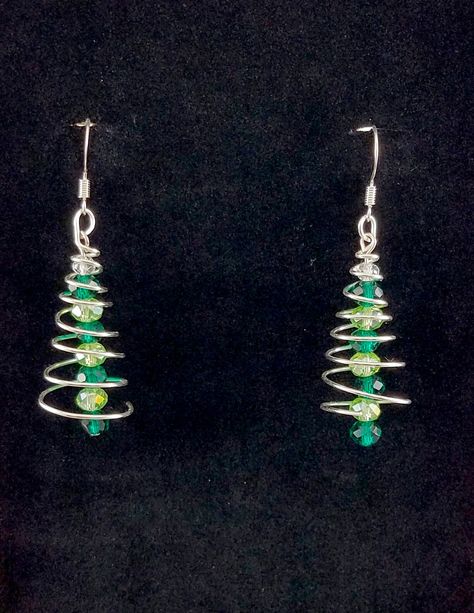 "These handmade spiral Christmas tree earrings are great for that office Christmas party. They're sure to be a conversation piece so you don't have to keep talking about the weather and \"how 'bout them Cowboys, eh?\"  Nickel free." Diy Christmas Earrings, Spiral Christmas Tree, Christmas Jewelry Diy, Wire Jewelry Earrings, Office Christmas Party, Keep Talking, Green And Silver, Tree Earrings, Christmas Tree Earrings