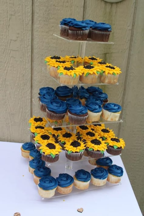 Navy Blue Roses And Sunflower Wedding, Sunflower Wedding Navy Blue, Red Blue And Sunflower Wedding, Wedding Ideas Yellow And Blue, Blue Cake With Sunflowers, Navy And Sunflower Wedding Decorations, Blue Sunflower Bouquet, Royal Blue And Sunflower Wedding Cake, Sunflower And Blue Centerpieces