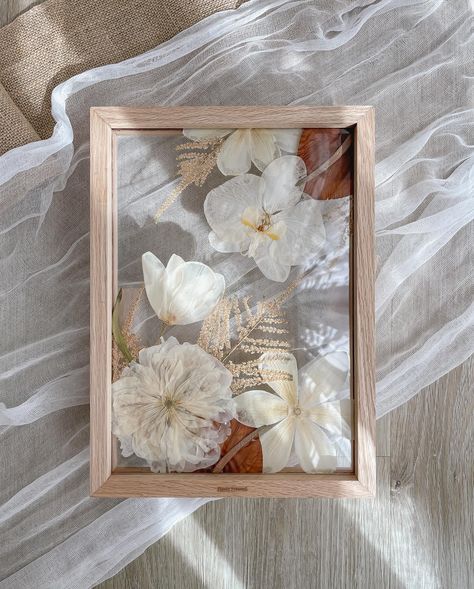 Classic all-white bouquet for Nicole ✨ Spot the anthurium that transformed into a completely different shade after pressing. Colour changing is a natural occurrence that happens during the drying process, and it can more apparent in some flowers than others. You can never be 100% sure of what you’re going to get, but that’s also part of the fun of flower pressing as you’ll never know what surprises await! Frame: A4 size, Natural #naturesgifts #pressedflowers #pressedweddingbouquet #weddingf... Framed Dried Flowers, Dried Flower Frame, Framed Flowers, Flower Pressing, Berry Wedding, Pressed Floral, Pressed Flower Crafts, Floral Preservation, Future Job