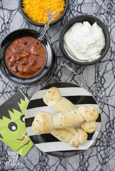 It's Halloweek! Host A Halloween Chili Bar - Revel and Glitter Halloween Chili Bar, Bone Breadsticks, Chili Bar Party, Halloween Chili, White Halloween Party, Chili Bar, Frozen Dinner Rolls, Frozen Rolls, Halloween Party Appetizers