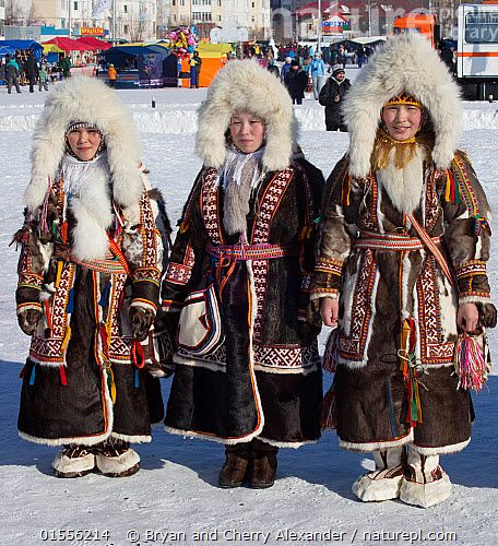 Nenets women competing in a traditional clothing competition during the reindeer herders' festival at Nadym. Yamal, Western Siberia, Russia People,Woman,Traditional,Few,Three,Group,Celebration Event,Occasion,Occasions,Festival,Russia,Siberia,Clothing,Traditional Clothing,Culture,Indigenous Culture,Russian Culture,Tribes,Siberian culture, Bryan and Cherry Alexander Inuit Clothing, Russian Coat, Inuit People, Nature Picture, Best Nature, Russian Culture, Unique Faces, Leather Workshop, Fur Parka